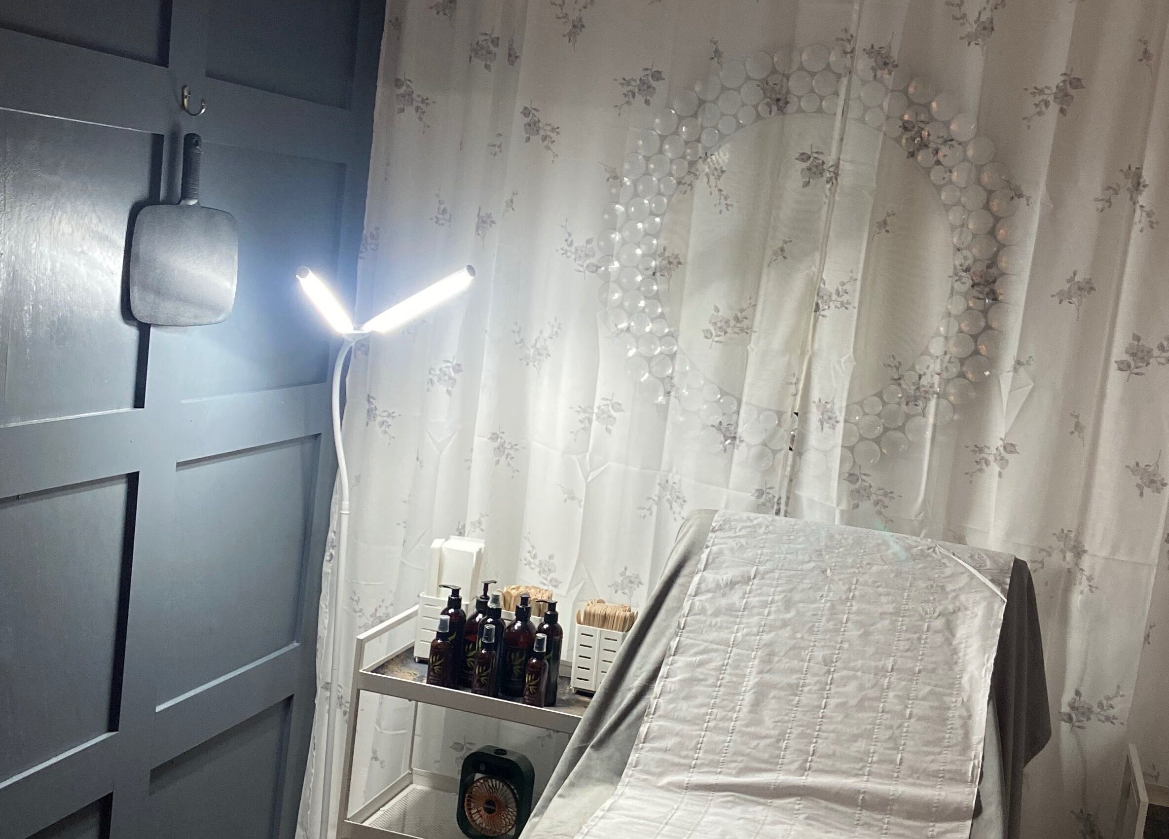 Simply Wax treatment room in Ballyclare, Northern Ireland, GB with soothing decor and a well-lit workspace.