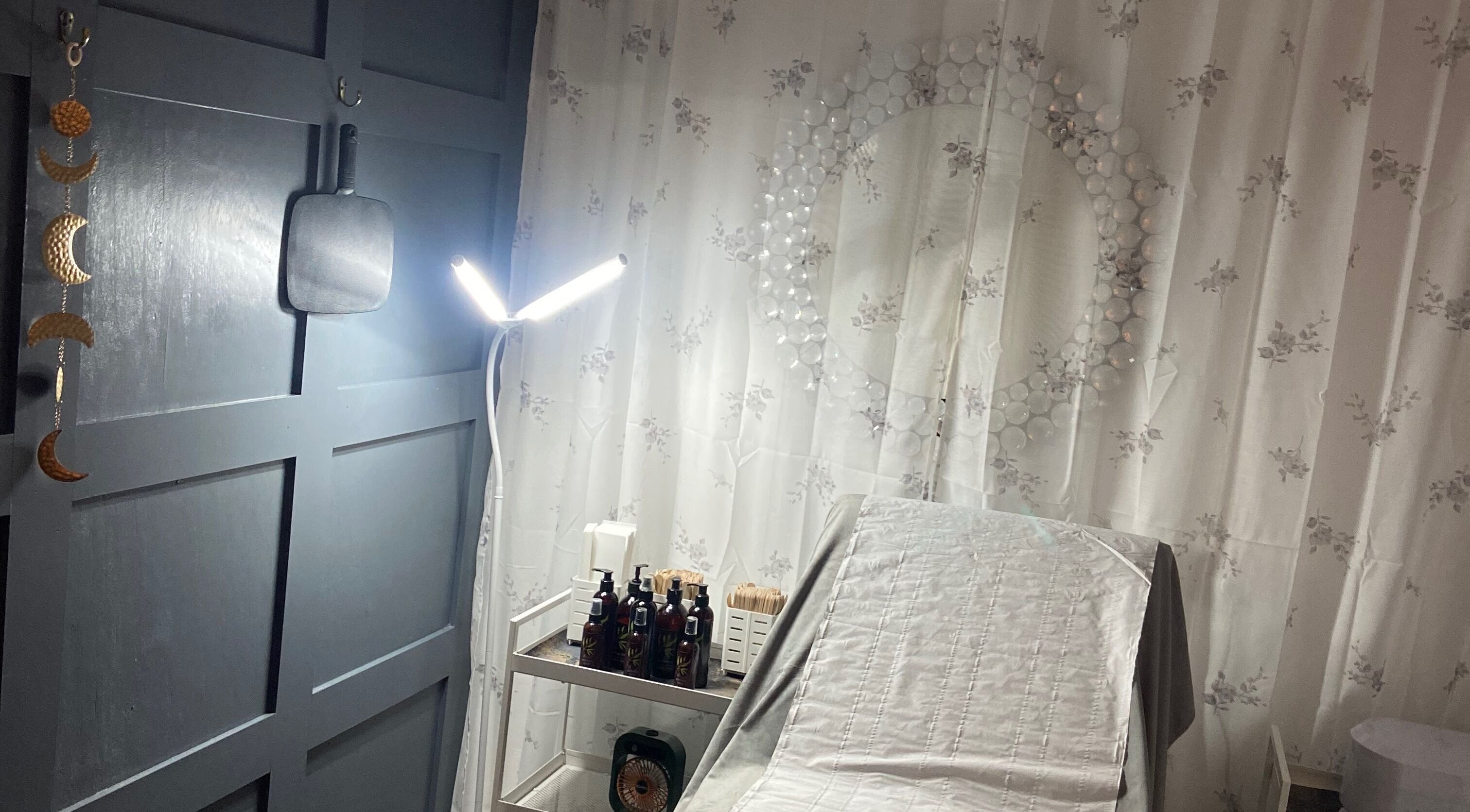 Simply Wax treatment room in Ballyclare, Northern Ireland, GB with soothing decor and a well-lit workspace.