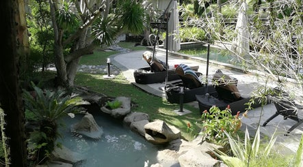 Relax by the serene pool at Sembunyi Spa, Cyberjaya, Selangor, MY amidst lush greenery and natural beauty.