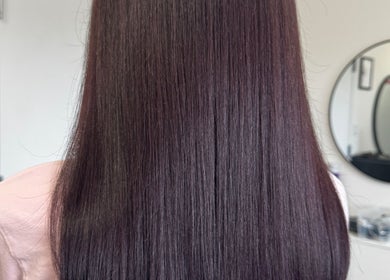 Sleek straight hair styled at Beauty Salon in San Diego, California, US reflecting expert hair care.