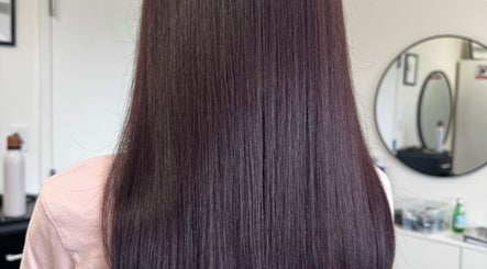 Sleek straight hair styled at Beauty Salon in San Diego, California, US reflecting expert hair care.