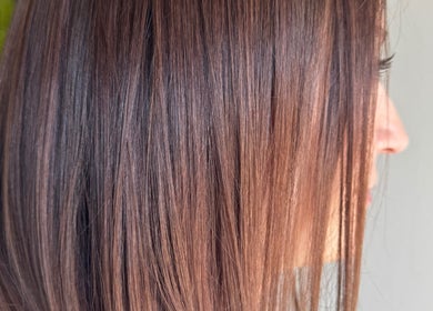 Close-up of sleek brown hair at Beauty Salon in San Diego, California, US.