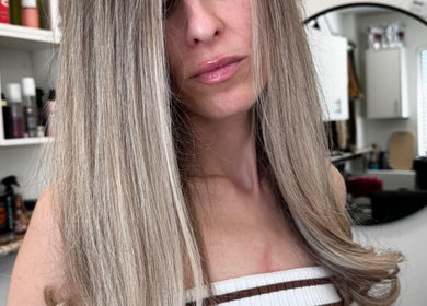 Sleek highlighted hairstyle at Beauty Salon, San Diego, California, US. Professional hair care and styling.