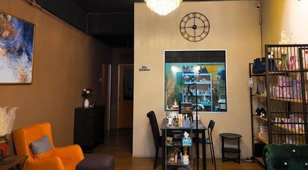 Inviting interior of Qasandra Spa Retreat in Petaling Jaya, Selangor, MY with modern decor and vibrant art.