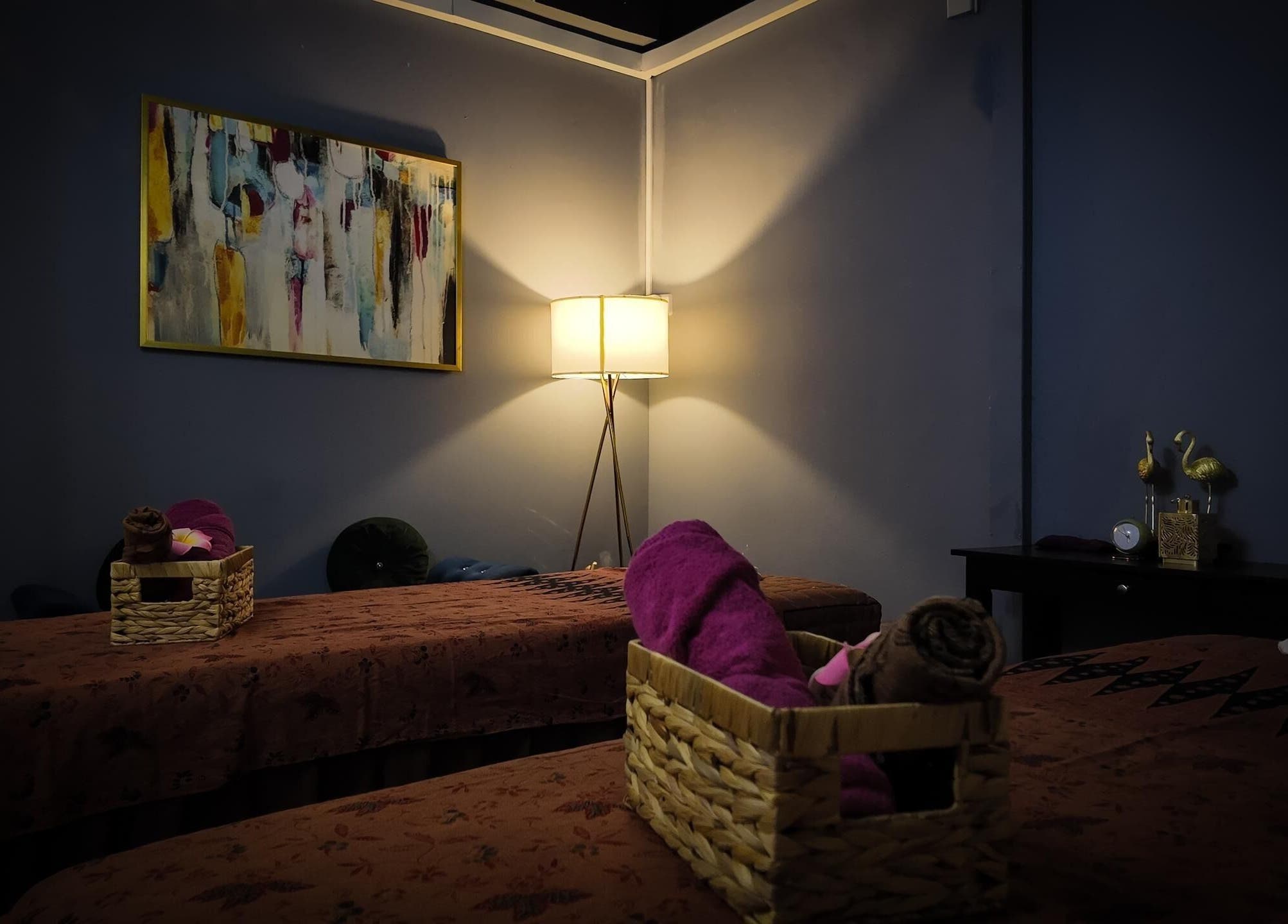 Cozy treatment room at Qasandra Spa Retreat in Petaling Jaya, Selangor, MY, featuring warm lighting and elegant decor.