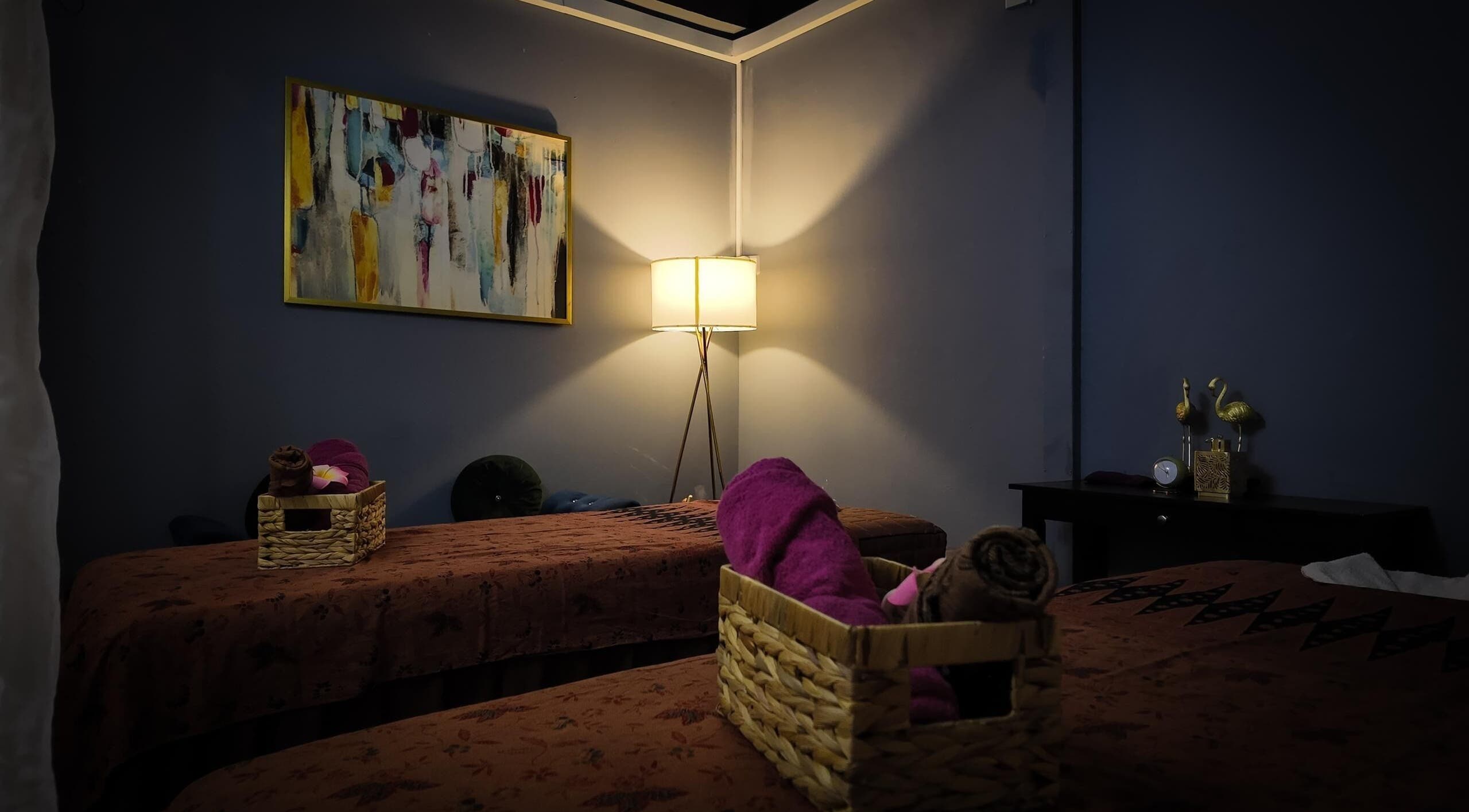 Cozy treatment room at Qasandra Spa Retreat in Petaling Jaya, Selangor, MY, featuring warm lighting and elegant decor.