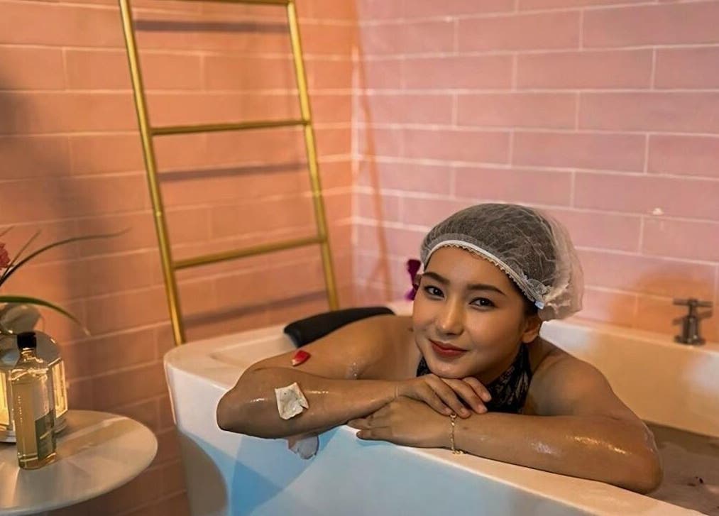 Woman enjoys a relaxing bath at Qasandra Spa Retreat in Petaling Jaya, Selangor, MY.
