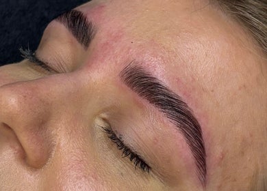 Close-up of beautifully shaped eyebrows at Grace Aesthetics, Cape Town, Western Cape, ZA.