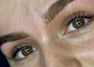 Close-up of expertly groomed brows at Grace Aesthetics, Cape Town, Western Cape, ZA, showcasing natural beauty.