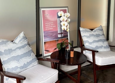 Comfortable seating area with cushions at Grace Aesthetics, Cape Town, Western Cape, ZA.