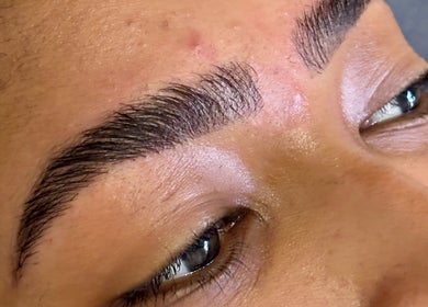 Close-up of expertly shaped eyebrows at Grace Aesthetics, Cape Town, Western Cape, ZA.