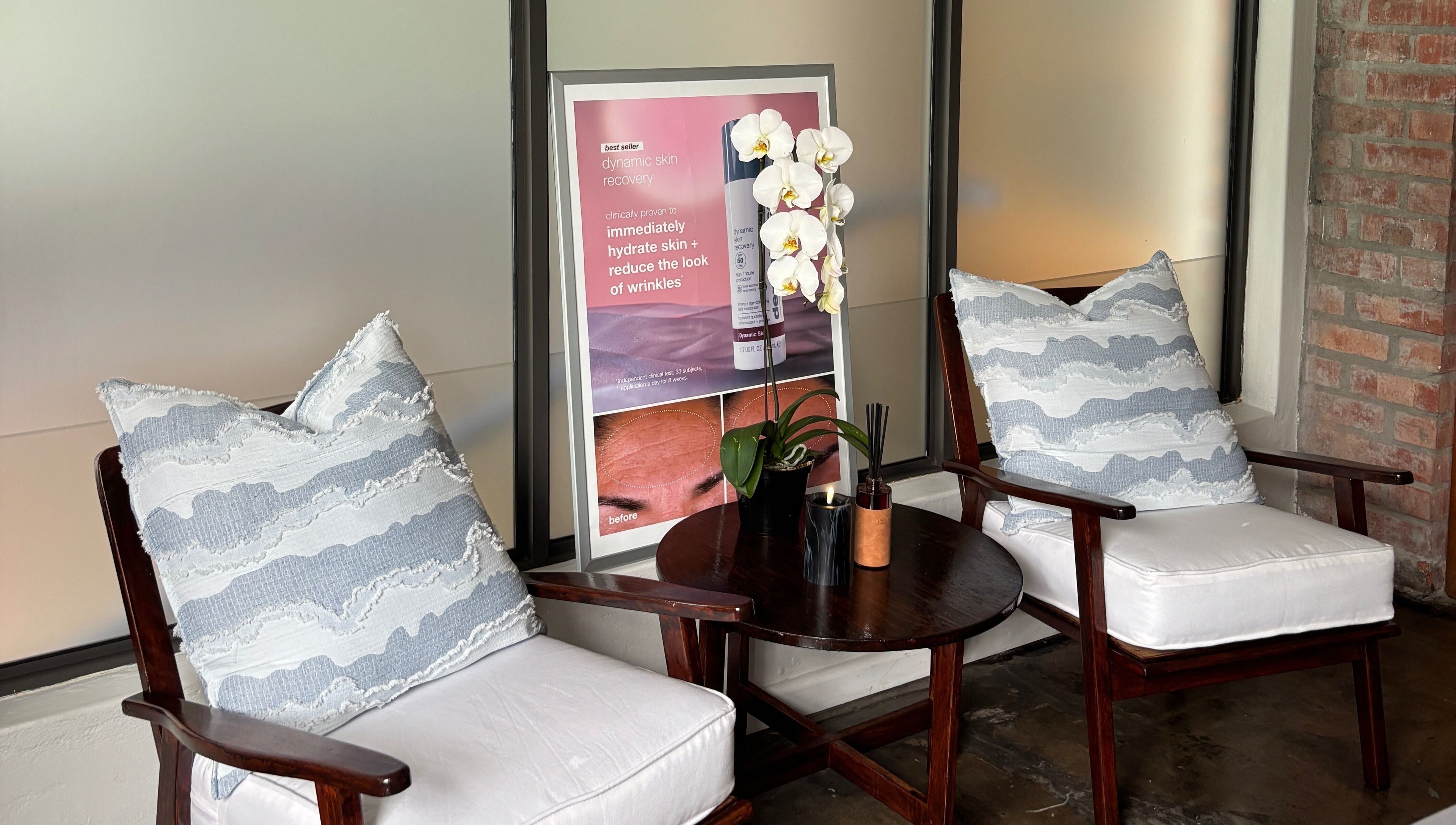 Elegant lounge area at Grace Aesthetics, Cape Town, Western Cape, ZA with cozy chairs and calming decor.
