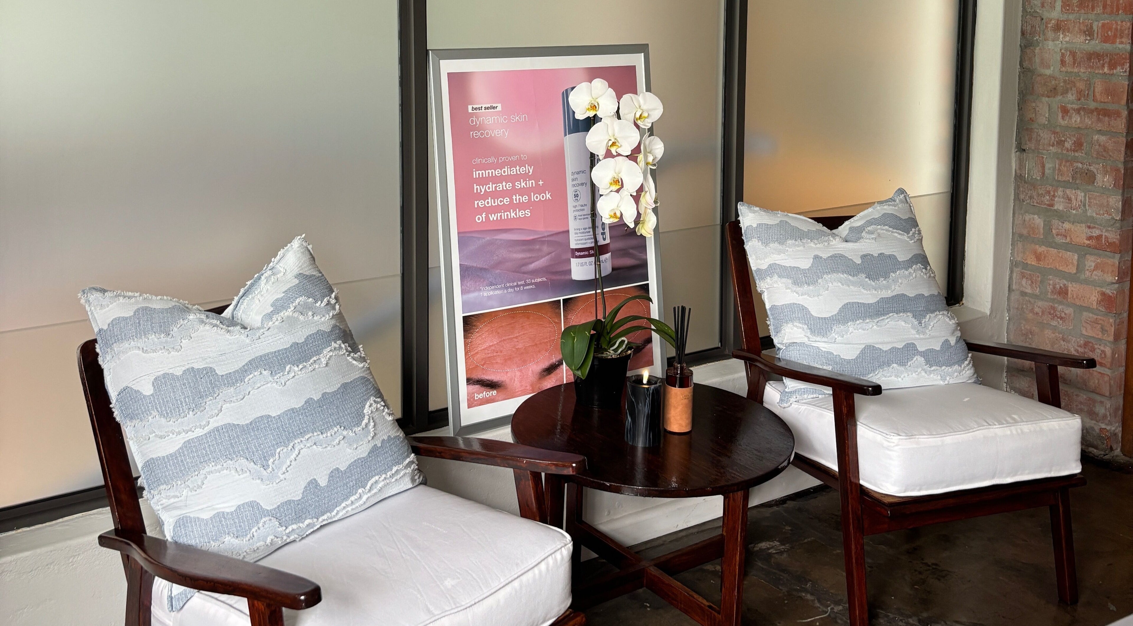 Elegant lounge area at Grace Aesthetics, Cape Town, Western Cape, ZA with cozy chairs and calming decor.