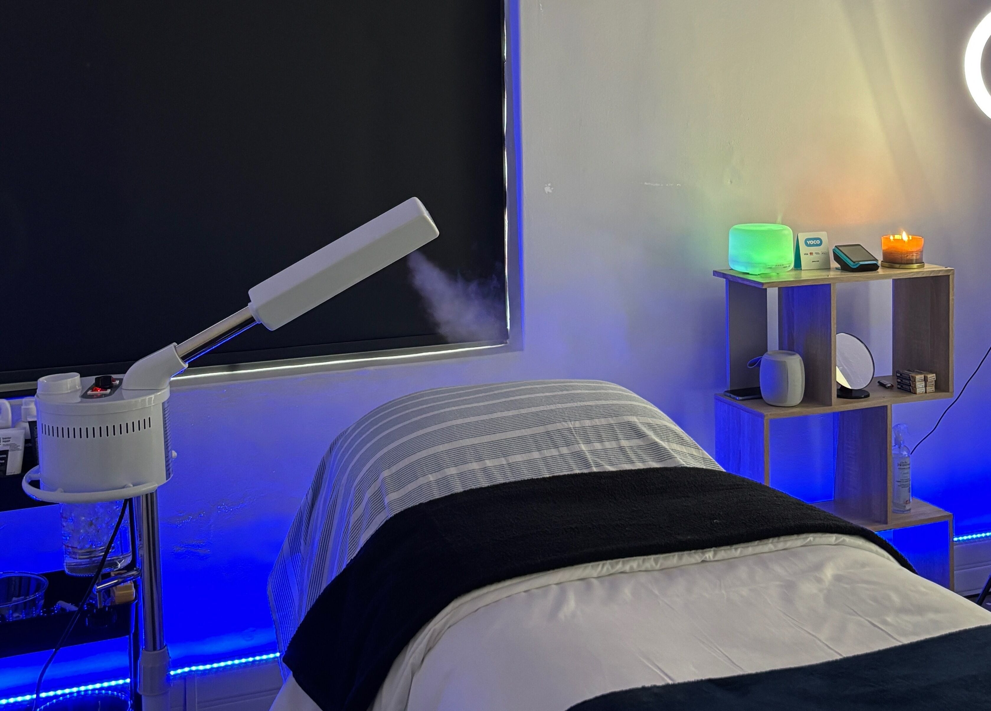 Relaxing spa room at Grace Aesthetics in Cape Town, Western Cape, ZA with a treatment bed and ambient lighting.