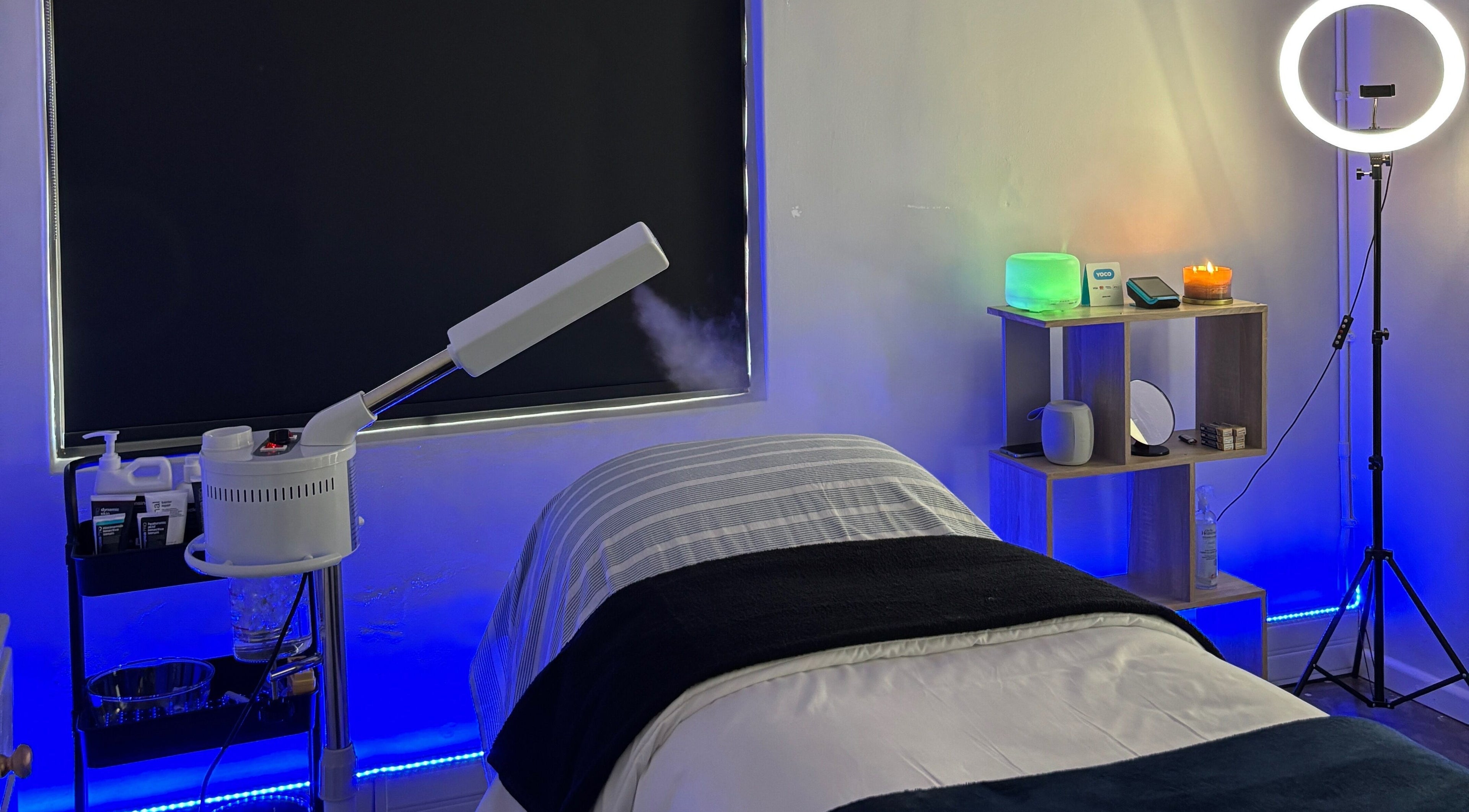 Relaxing spa room at Grace Aesthetics in Cape Town, Western Cape, ZA with a treatment bed and ambient lighting.