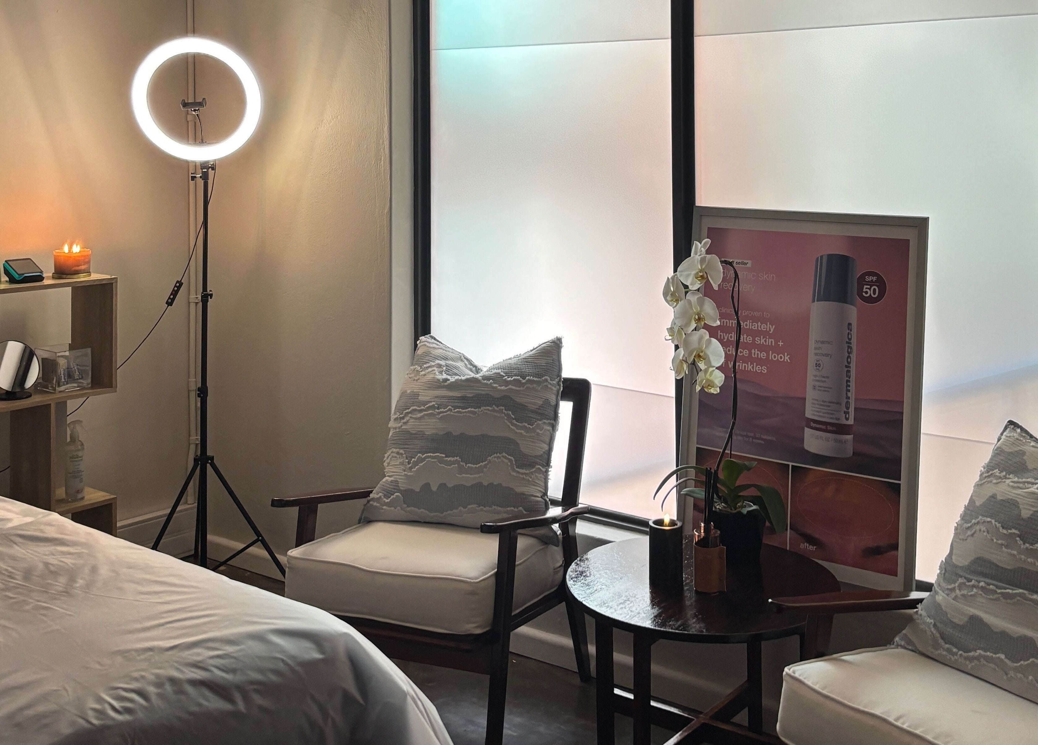 Relaxing spa room at Grace Aesthetics, Cape Town, Western Cape, ZA, with soft lighting and elegant decor.