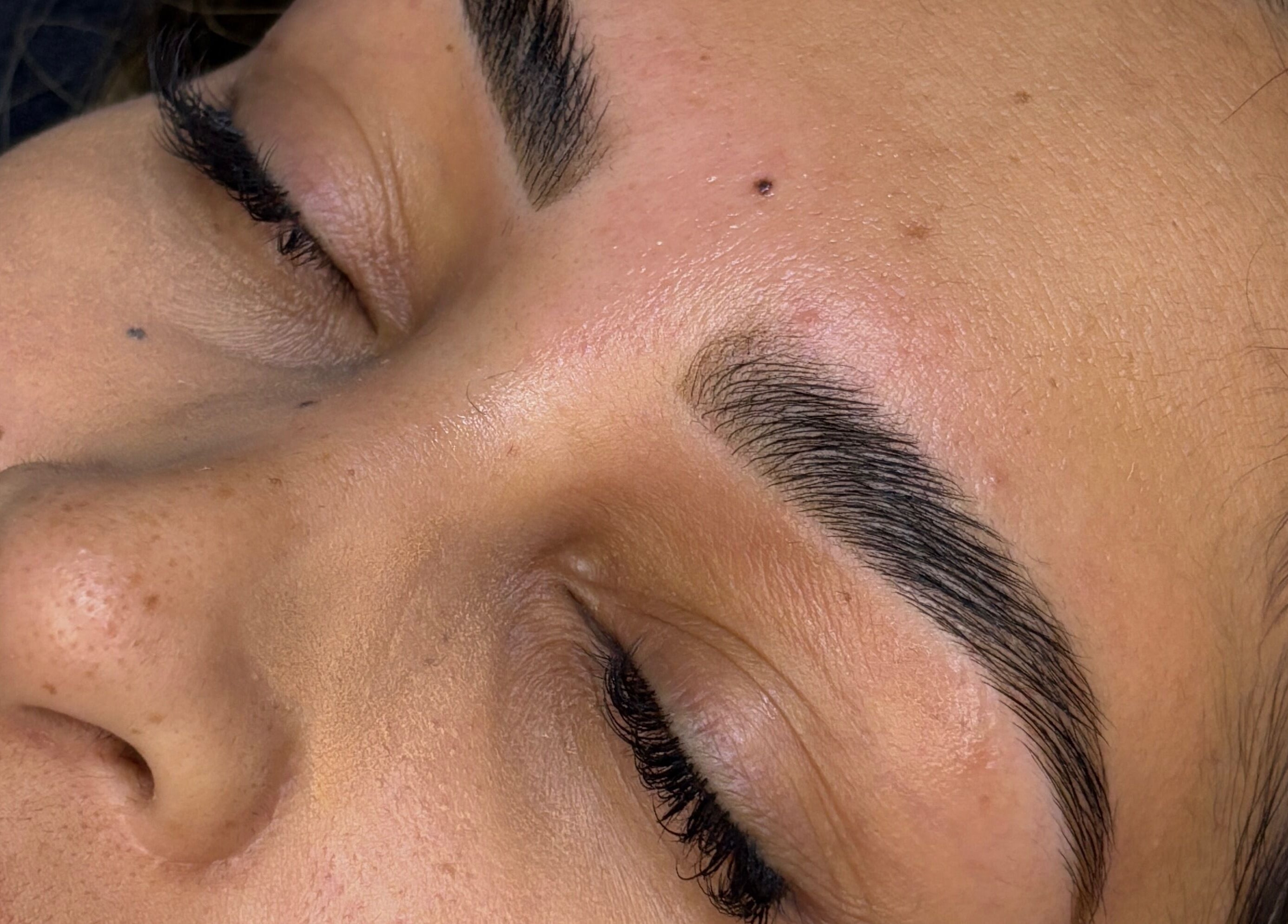 Close-up of perfectly shaped eyebrows at Grace Aesthetics, Cape Town, Western Cape, ZA.