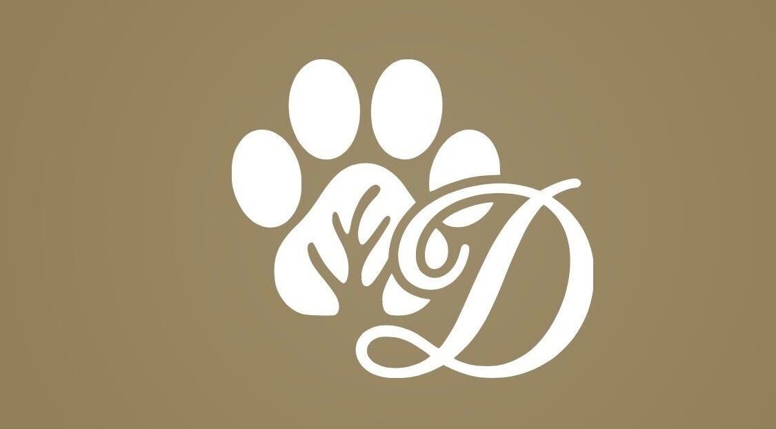 Logo of Diana’s Dog Grooming Salon on Compass Hill, County Cork, IE featuring a stylized paw print and letter D.