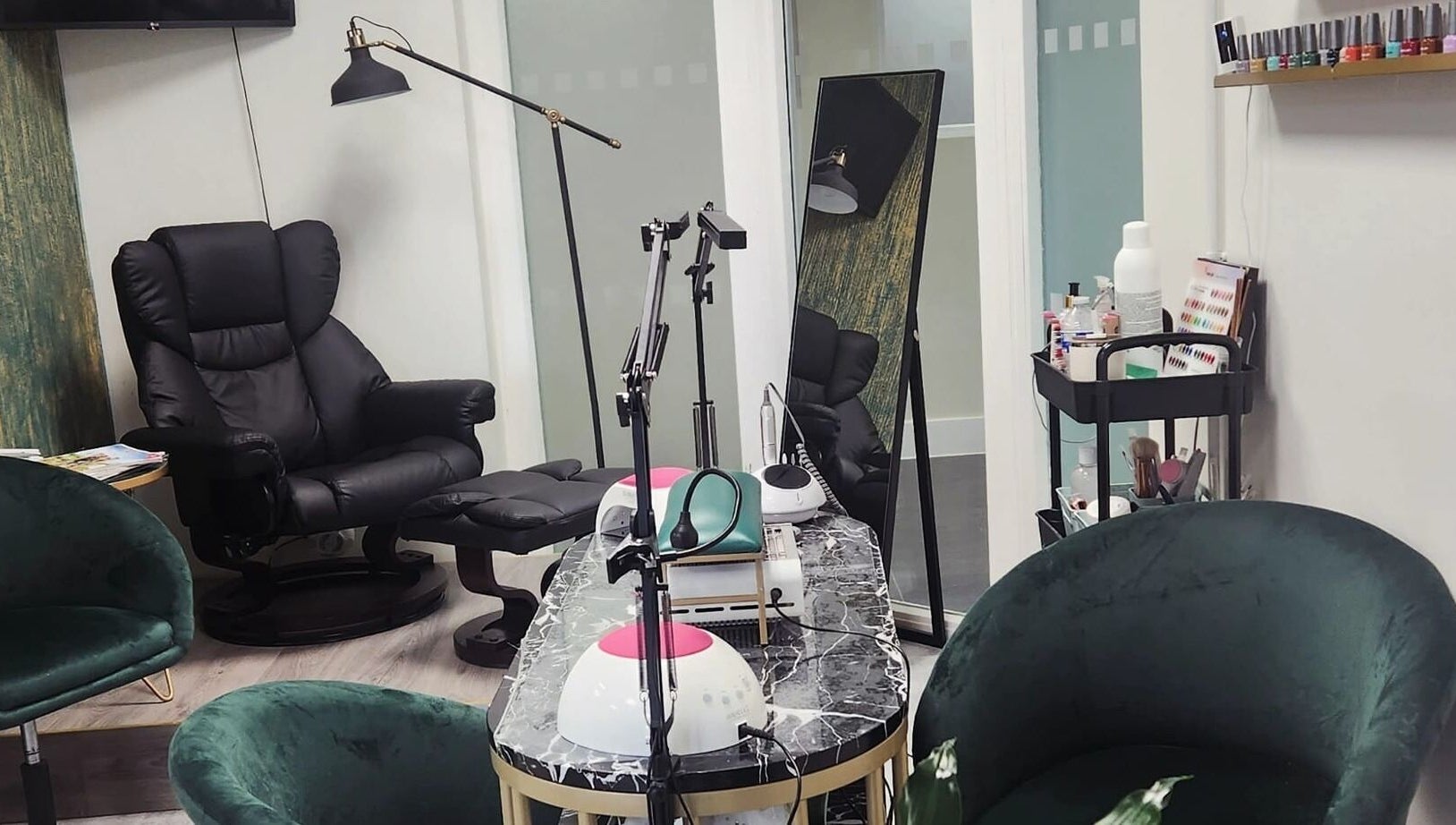 Chic salon interior at Maketimeforyou, Houghton Regis, England, GB with plush chairs and manicure stations.