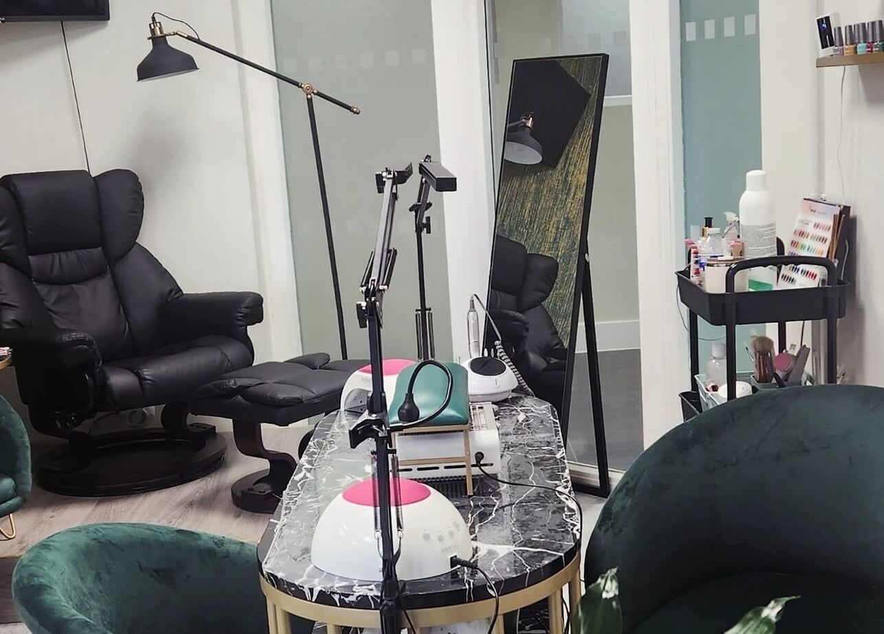 Chic salon interior at Maketimeforyou, Houghton Regis, England, GB with plush chairs and manicure stations.