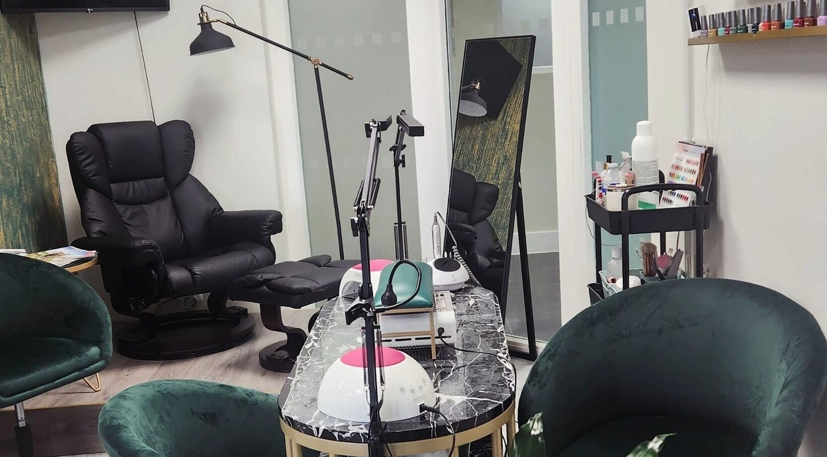 Chic salon interior at Maketimeforyou, Houghton Regis, England, GB with plush chairs and manicure stations.