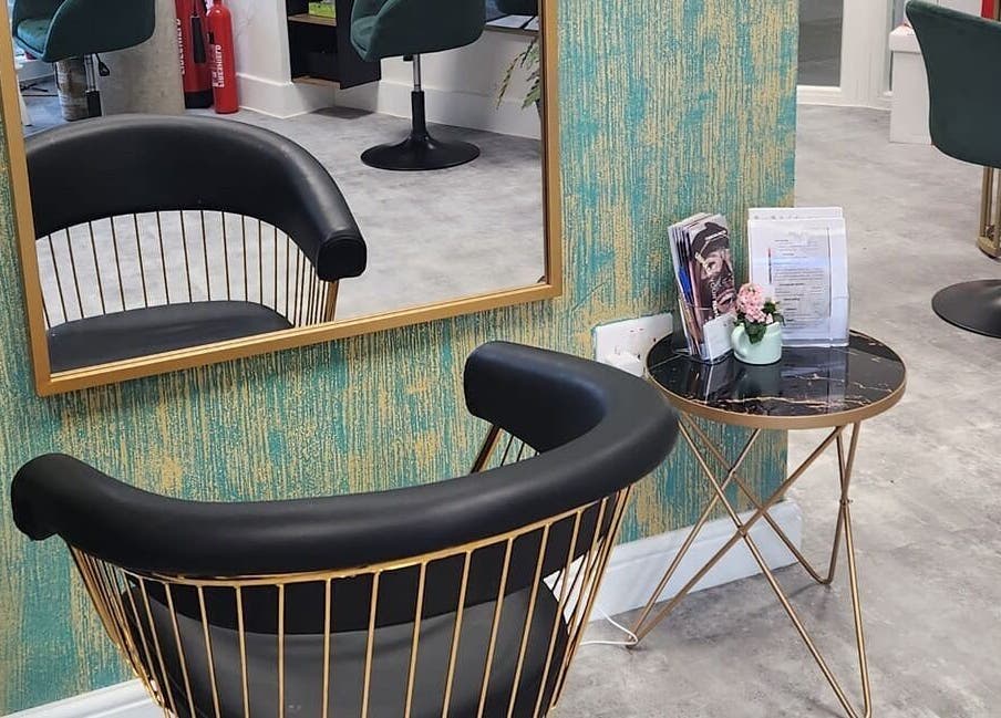 Stylish waiting area at Maketimeforyou in Houghton Regis, England, GB with modern chair and marble table.
