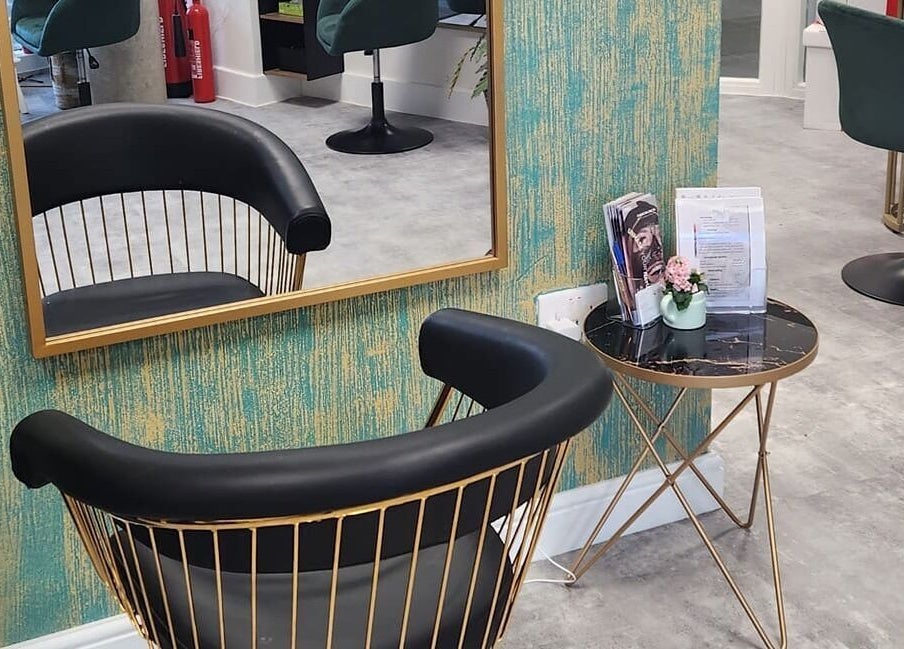 Stylish waiting area at Maketimeforyou in Houghton Regis, England, GB with modern chair and marble table.