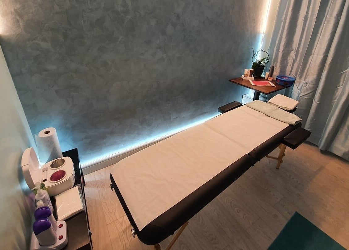 Relaxing spa treatment room at Maketimeforyou in Houghton Regis, England, GB, featuring a massage table and soothing decor.