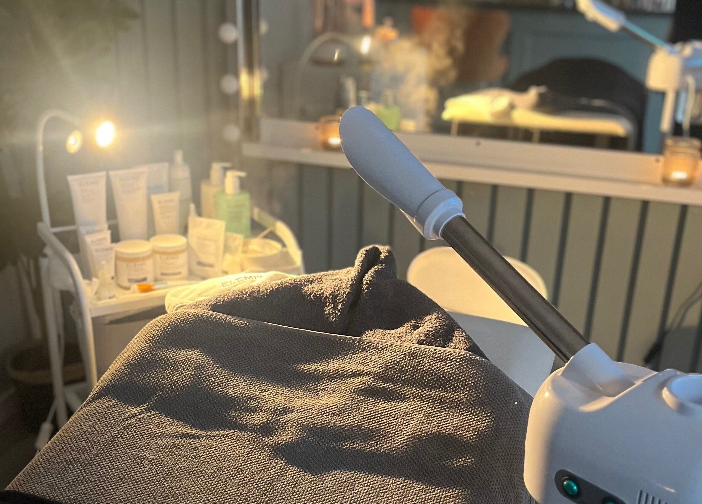 Cozy treatment room at Beauty Bar, Celbridge, County Kildare, IE with skincare products and a steam machine.