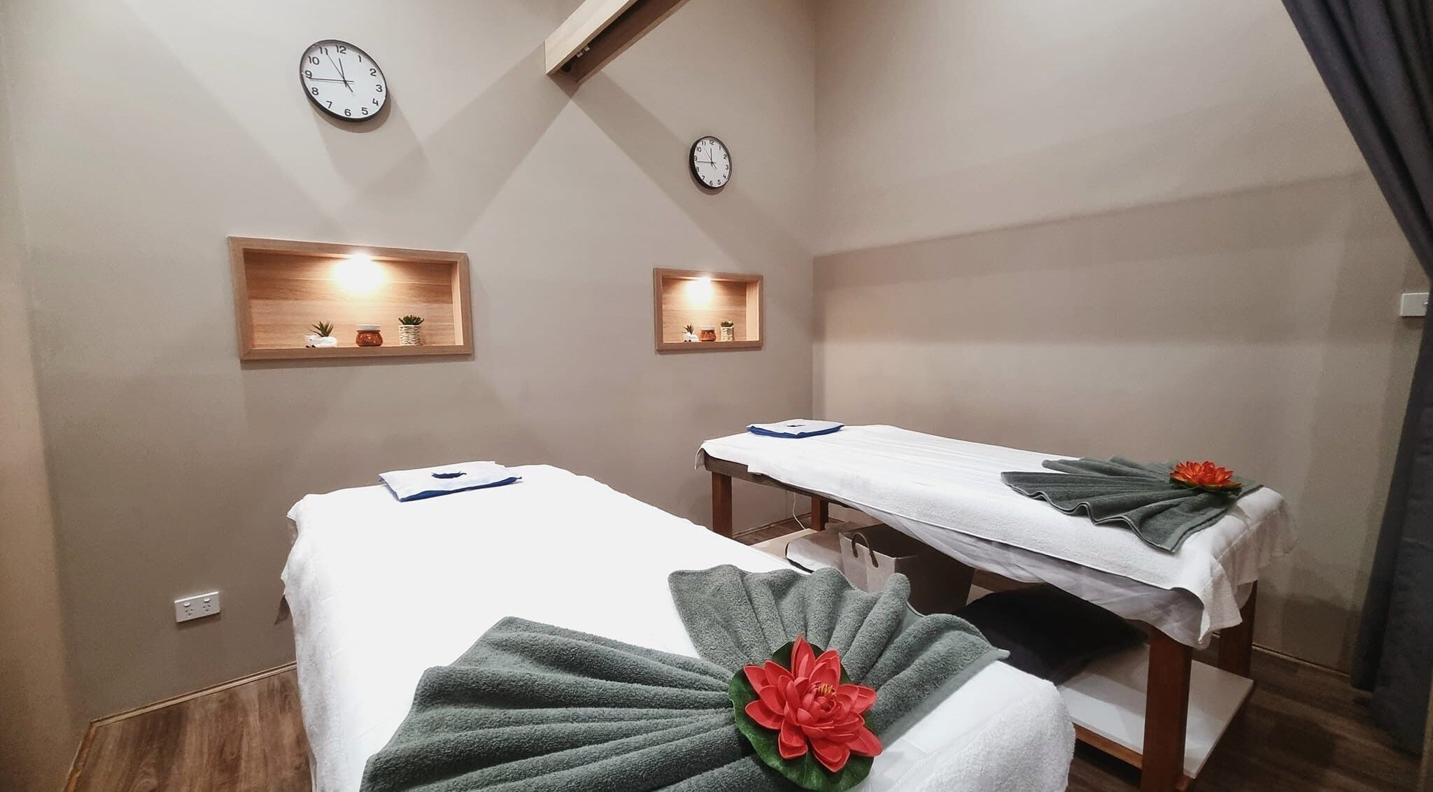 Relaxing massage room at Siam Health - Wolli Creek, featuring two tables and ambient lighting in Wolli Creek, New South Wales, AU.