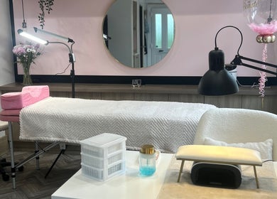 Serene beauty room at House of Beauté in Ibstock, England, GB, featuring a plush treatment bed and soft lighting.