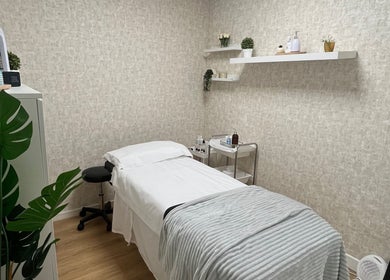 Calming treatment room at Radiant Beauty Clinic, Dublin 7, IE, featuring a cozy bed and relaxing decor.