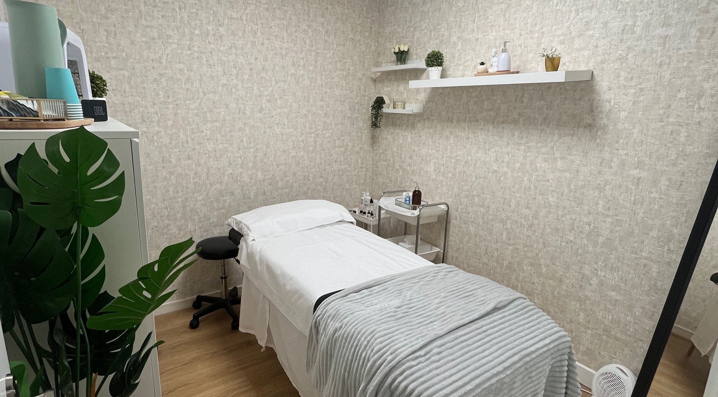 Calming treatment room at Radiant Beauty Clinic, Dublin 7, IE, featuring a cozy bed and relaxing decor.