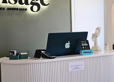 Reception desk at Visage Clinics Australia | Merrylands, New South Wales, AU with elegant decor and branding.