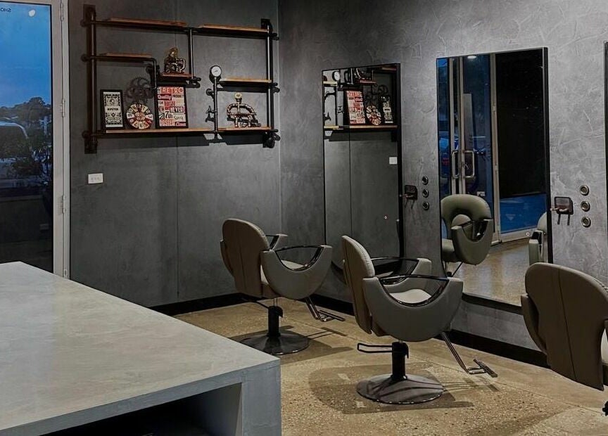 Stylish salon setup at The One Fashion Hair, Melbourne, Victoria, AU with modern chairs and mirrors.