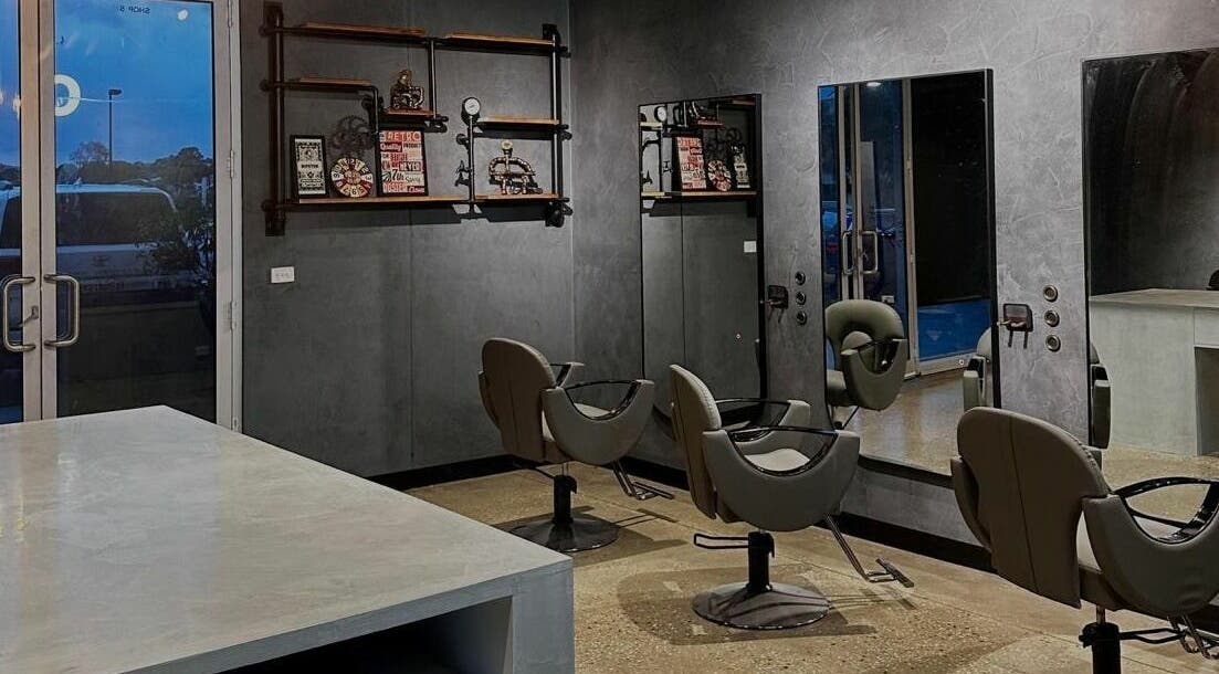 Stylish salon setup at The One Fashion Hair, Melbourne, Victoria, AU with modern chairs and mirrors.