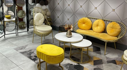 Luxurious seating area at Narure Luxe Aesthetics, Emalahleni, Mpumalanga, ZA, with yellow cushions and modern decor.