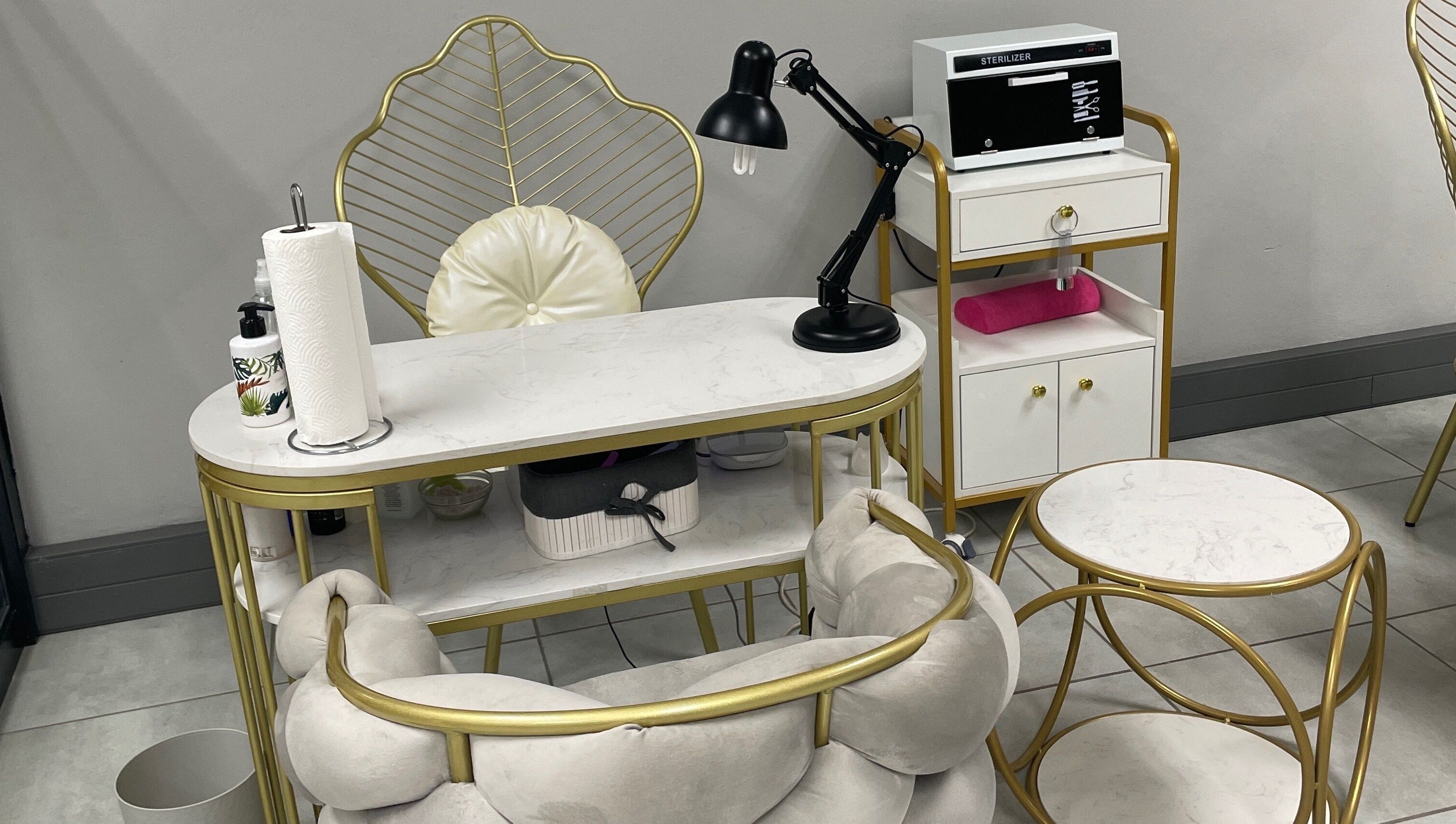 Luxurious nail station at Narure Luxe Aesthetics, Emalahleni, Mpumalanga, ZA with gold accents and modern decor.