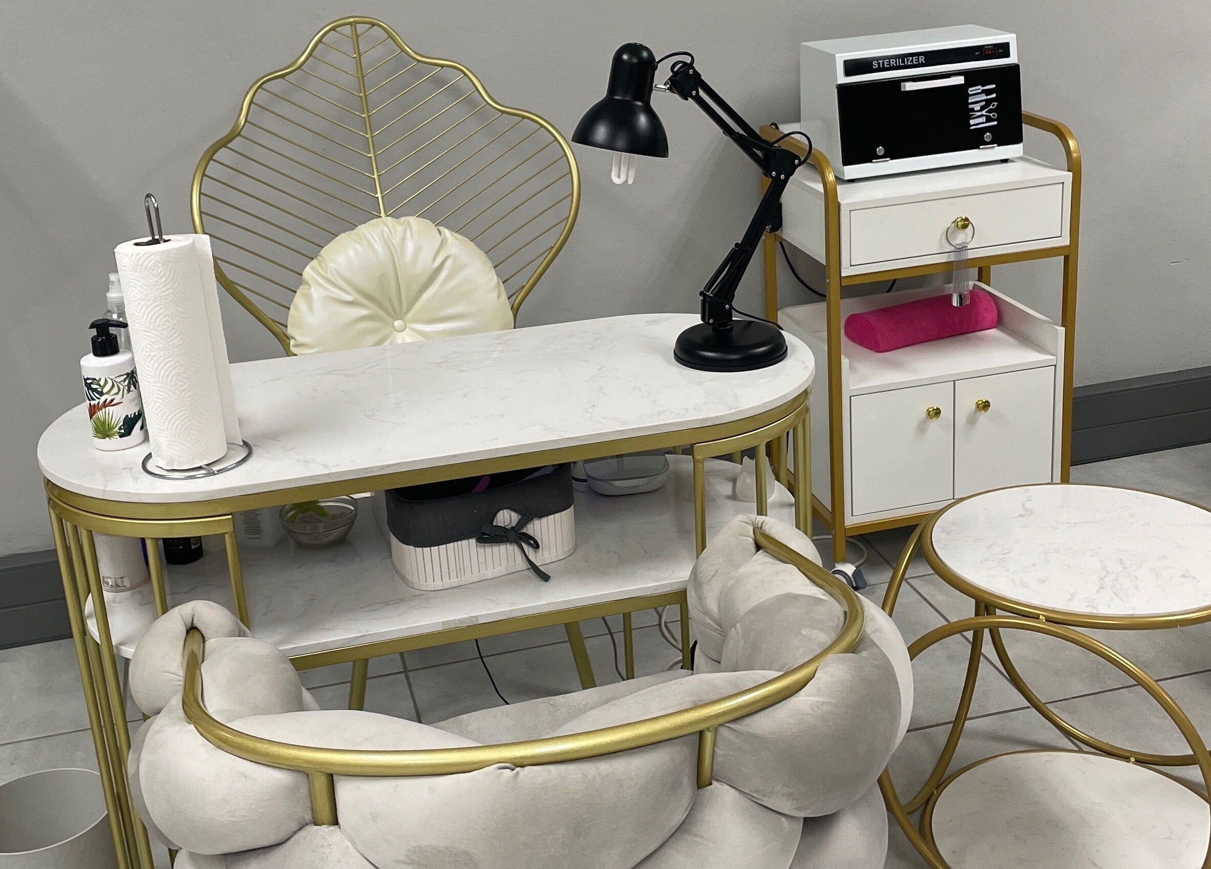 Luxurious nail station at Narure Luxe Aesthetics, Emalahleni, Mpumalanga, ZA with gold accents and modern decor.