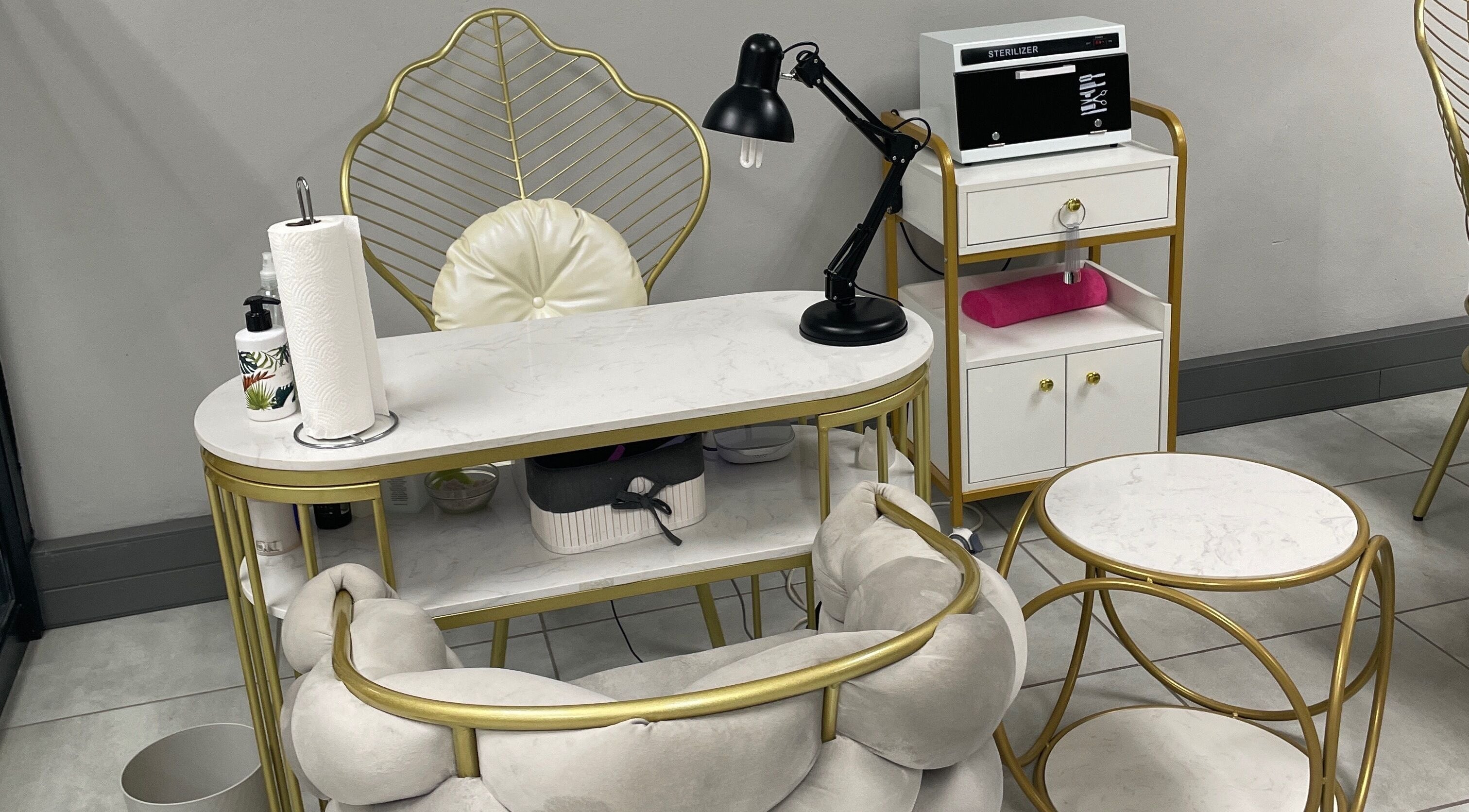 Luxurious nail station at Narure Luxe Aesthetics, Emalahleni, Mpumalanga, ZA with gold accents and modern decor.