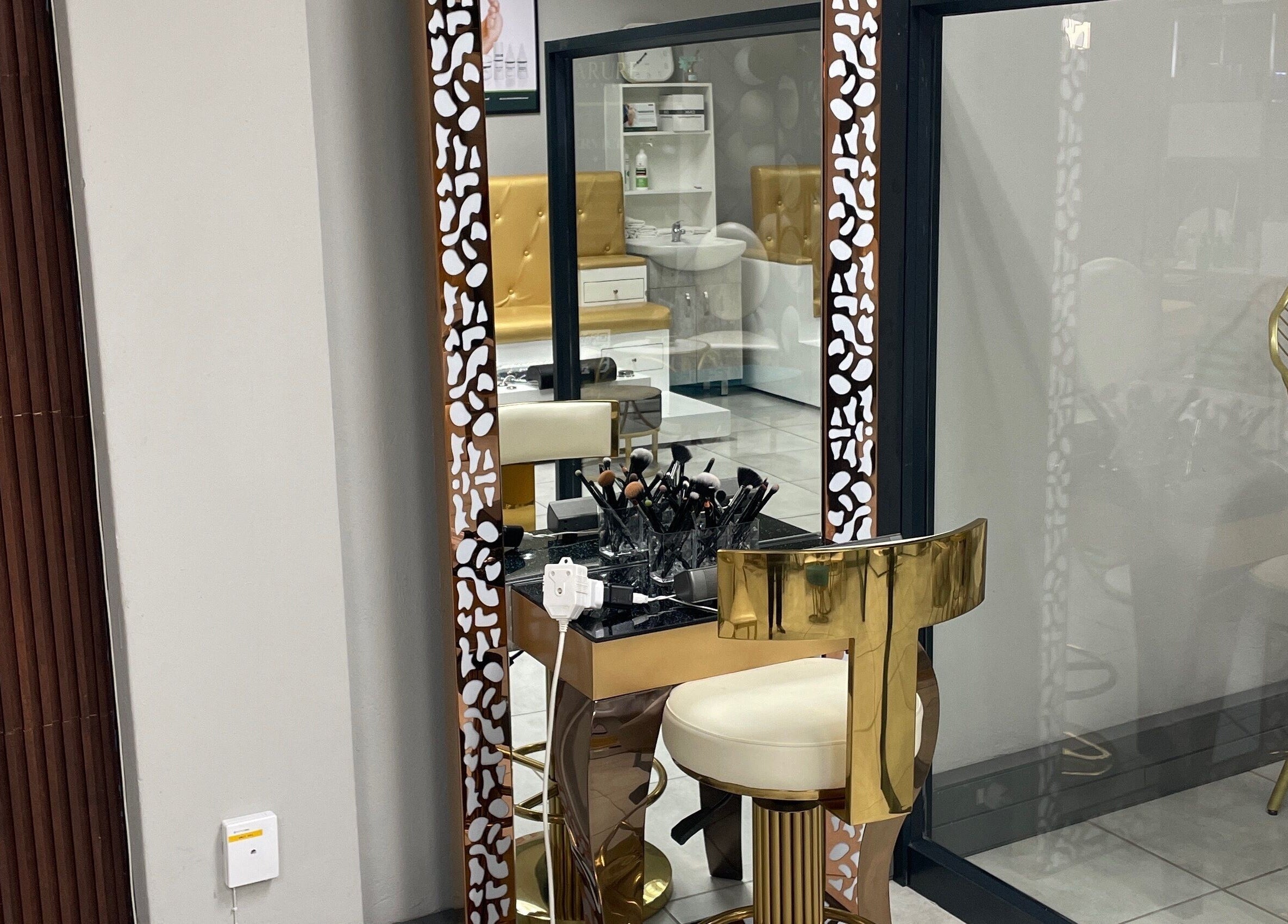 Luxurious makeup station at Narure Luxe Aesthetics, Emalahleni, Mpumalanga, ZA with gold accents.