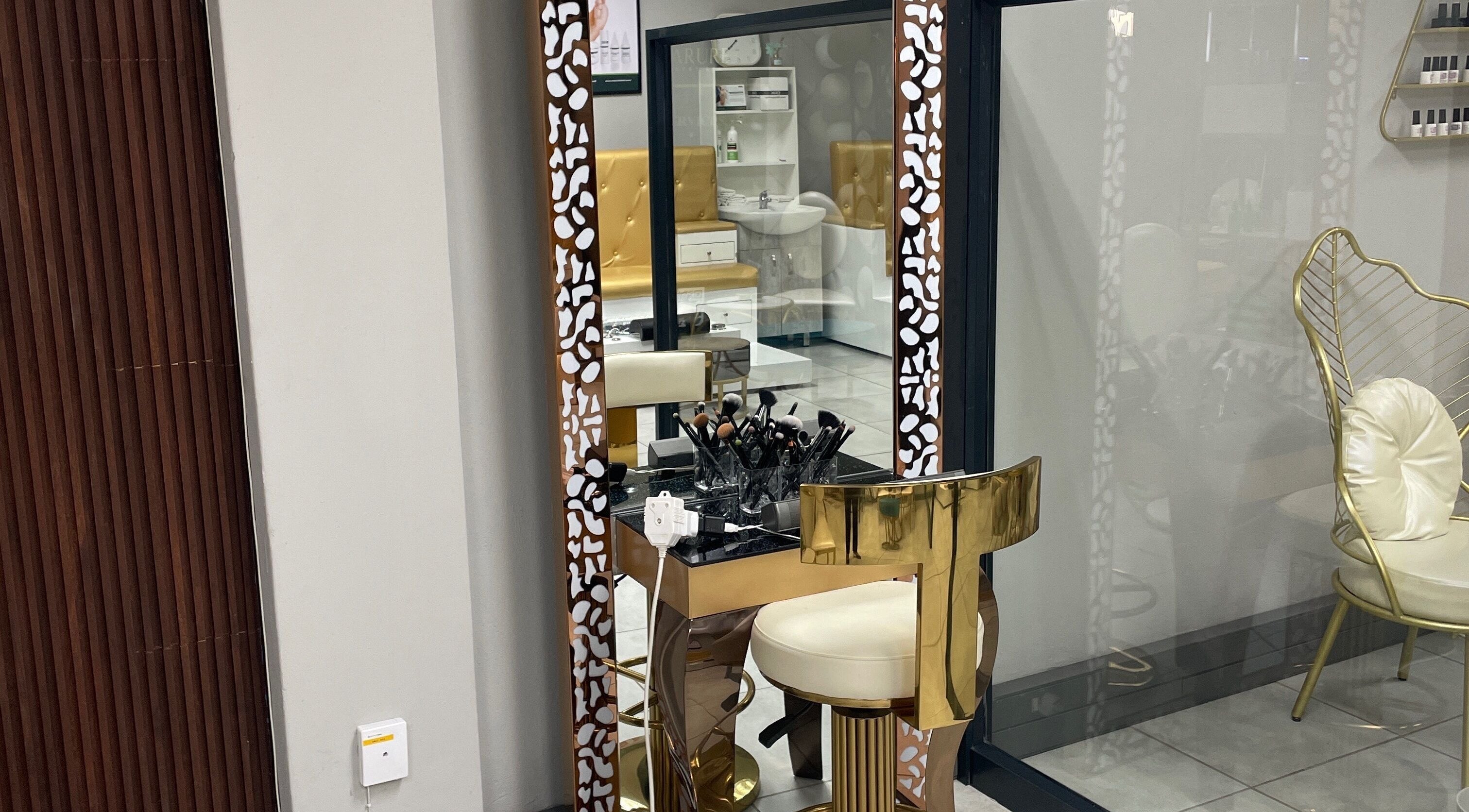 Luxurious makeup station at Narure Luxe Aesthetics, Emalahleni, Mpumalanga, ZA with gold accents.
