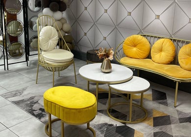 Stylish seating area at Narure Luxe Aesthetics, Emalahleni, Mpumalanga, ZA with yellow cushions and geometric decor.