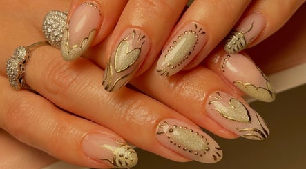 Intricate nail art with golden accents at Neuro Nails, Blenheim, Marlborough, NZ.