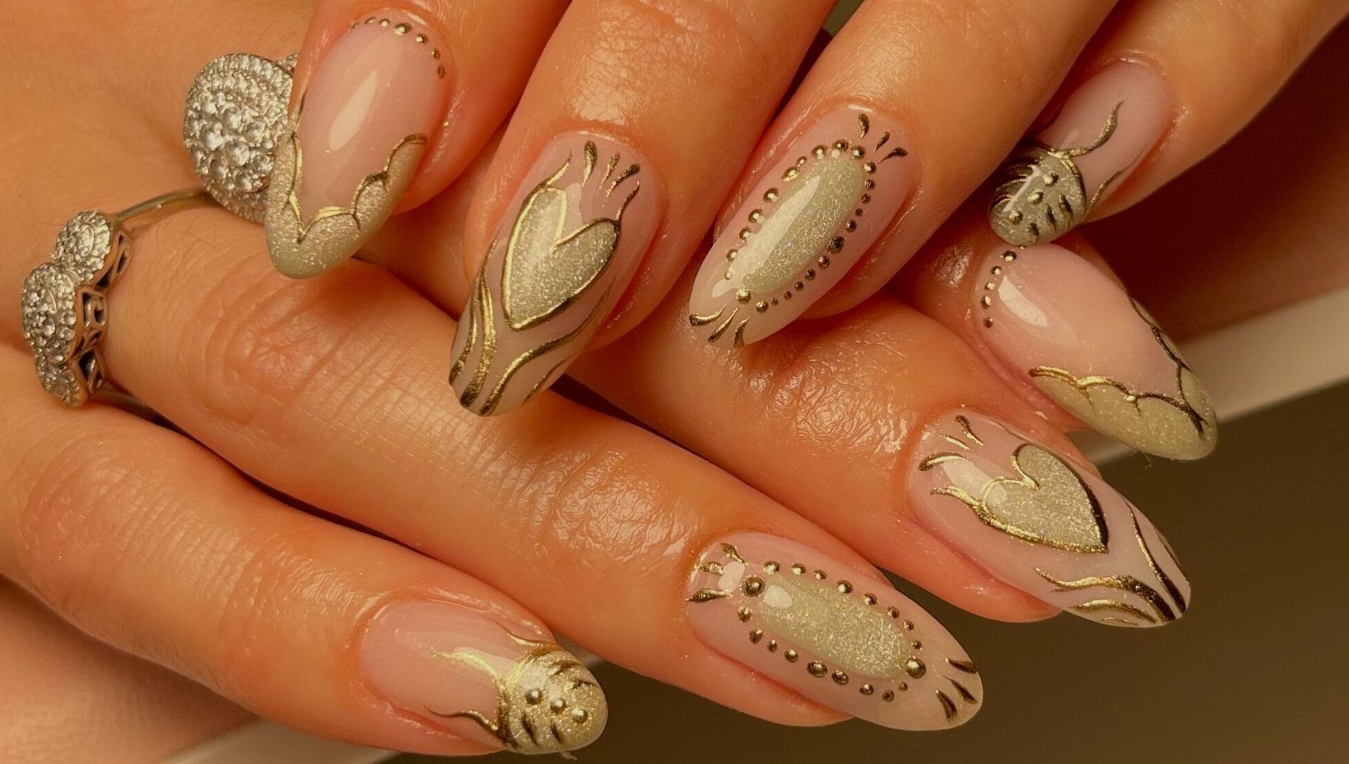 Intricate gold nail art at Neuro Nails, Blenheim, Marlborough, NZ. Perfect for special occasions.