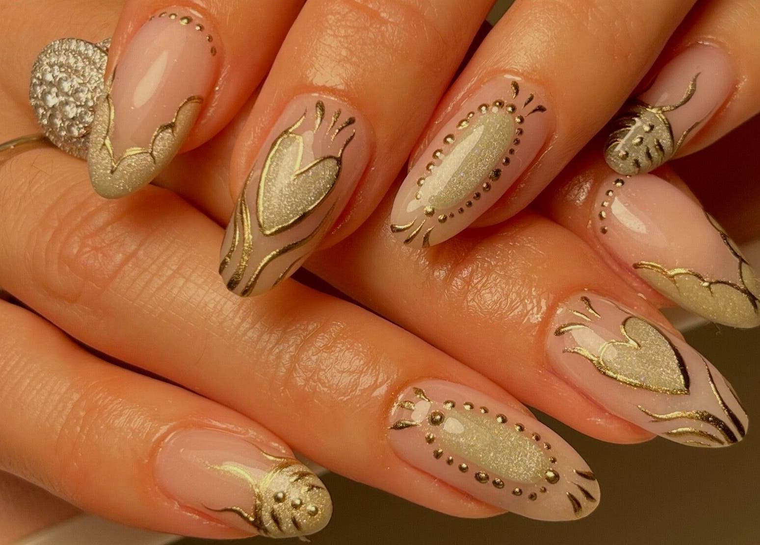 Intricate gold nail art at Neuro Nails, Blenheim, Marlborough, NZ. Perfect for special occasions.