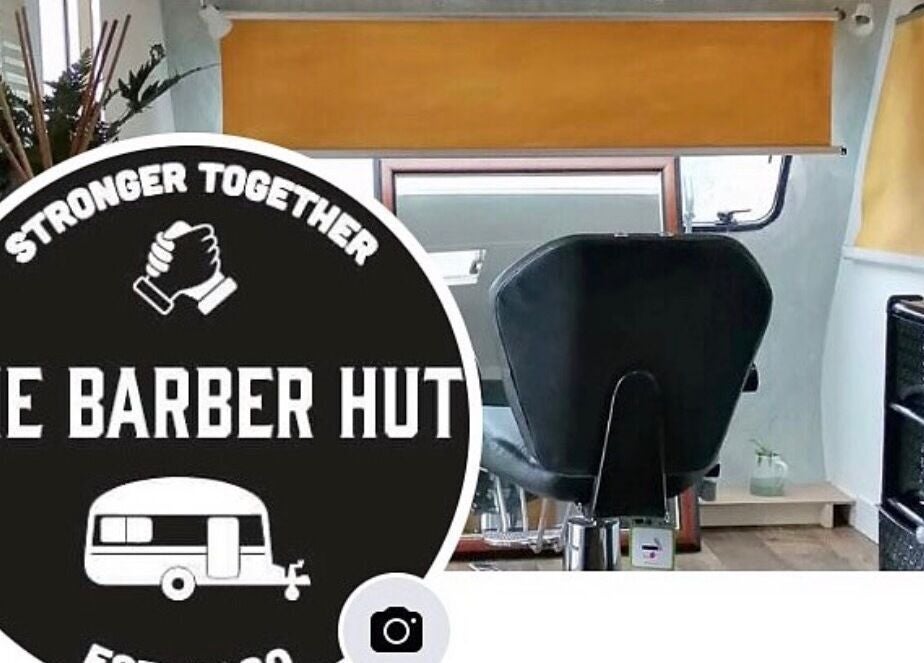 Interior view of The Barber Hut, Portrush, Northern Ireland with a stylish barber chair and modern decor.