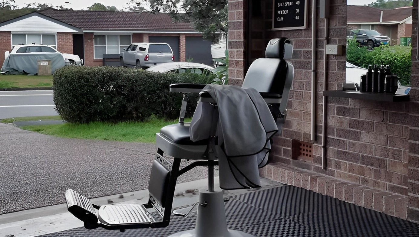 Barber chair in Kavi's Kutz, Kariong, New South Wales, AU, by the window showcasing comfortable seating.