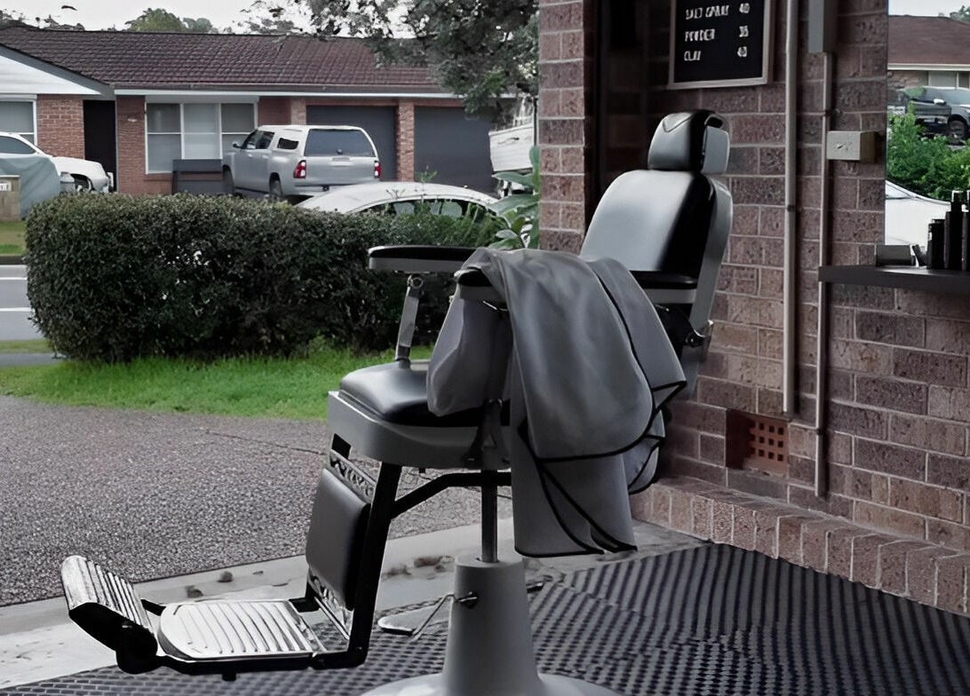 Barber chair in Kavi's Kutz, Kariong, New South Wales, AU, by the window showcasing comfortable seating.