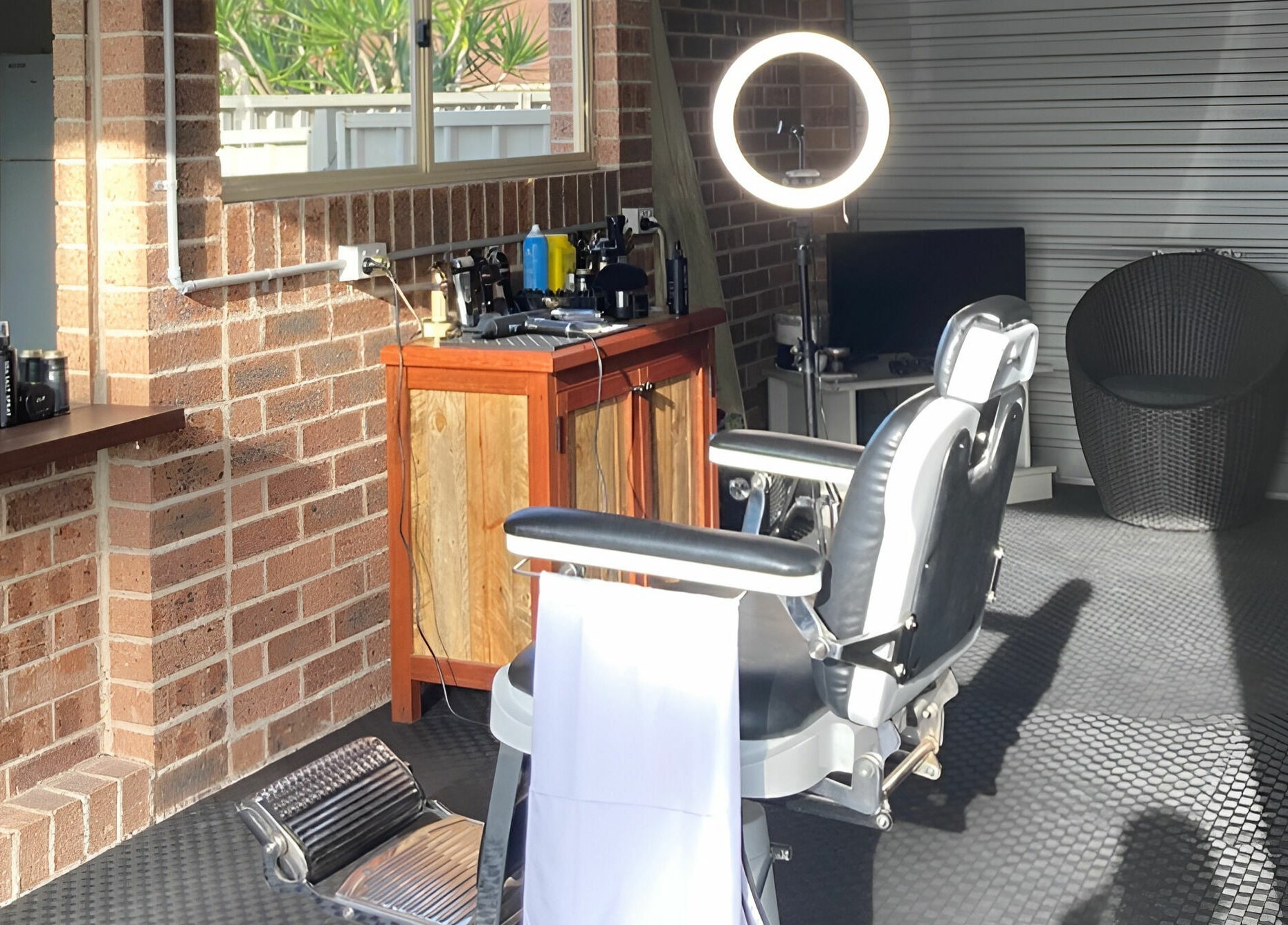 Bright barber chair setup at Kavi's Kutz, Kariong, New South Wales, AU with modern decor and lighting.